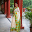 Ivory Bishnupur silk saree with hand painted yellow sunflower and green leaves