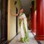 Ivory Bishnupur silk saree with hand painted yellow sunflower and green leaves