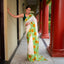 Ivory Bishnupur silk saree with hand painted yellow sunflower and green leaves