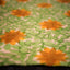 Ivory Bishnupur silk saree with hand painted yellow sunflower and green leaves