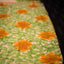Ivory Bishnupur silk saree with hand painted yellow sunflower and green leaves