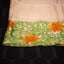 Ivory Bishnupur silk saree with hand painted yellow sunflower and green leaves