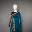 Rangrekha Ocean Teal Silk Cotton Jamdani Saree – Crimson-Edged Gold Zari Border