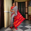 Black and white Bishnupuri silk saree with red, dark pink and orange striped Pallu and border