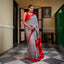Black and white Bishnupuri silk saree with red, dark pink and orange striped Pallu and border